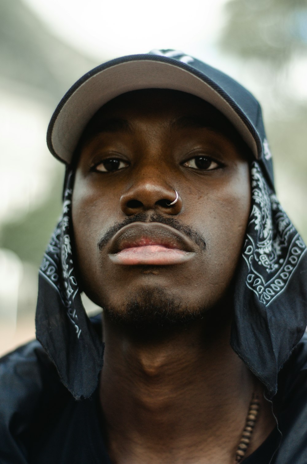 man in black and white bandana