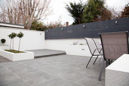 A completed modern patio with clean lines and comfortable seating.