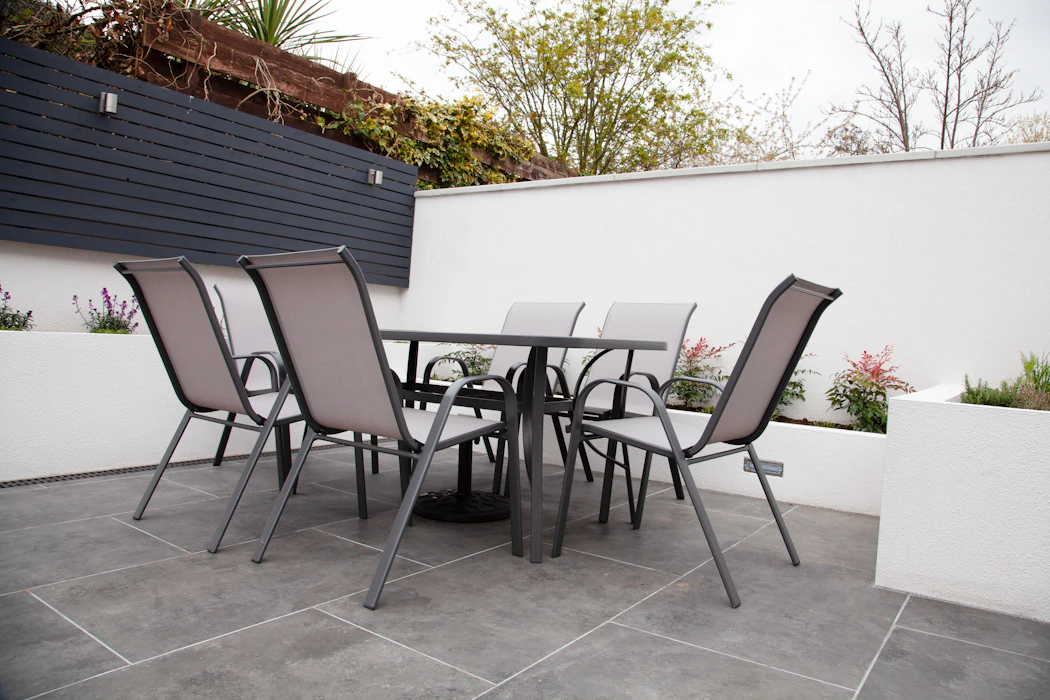 Black and gray patio chairs and table