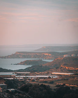 Elegant coastline view at golden hour in Ericeira with subtle warm lighting.