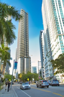 A bustling Dubai financial district street with modern skyscrapers and busy professionals.