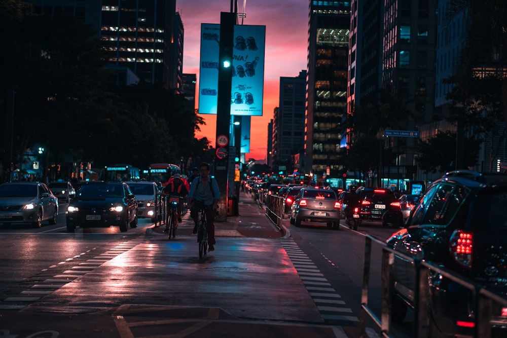 people walking on pedestrian lane during night time