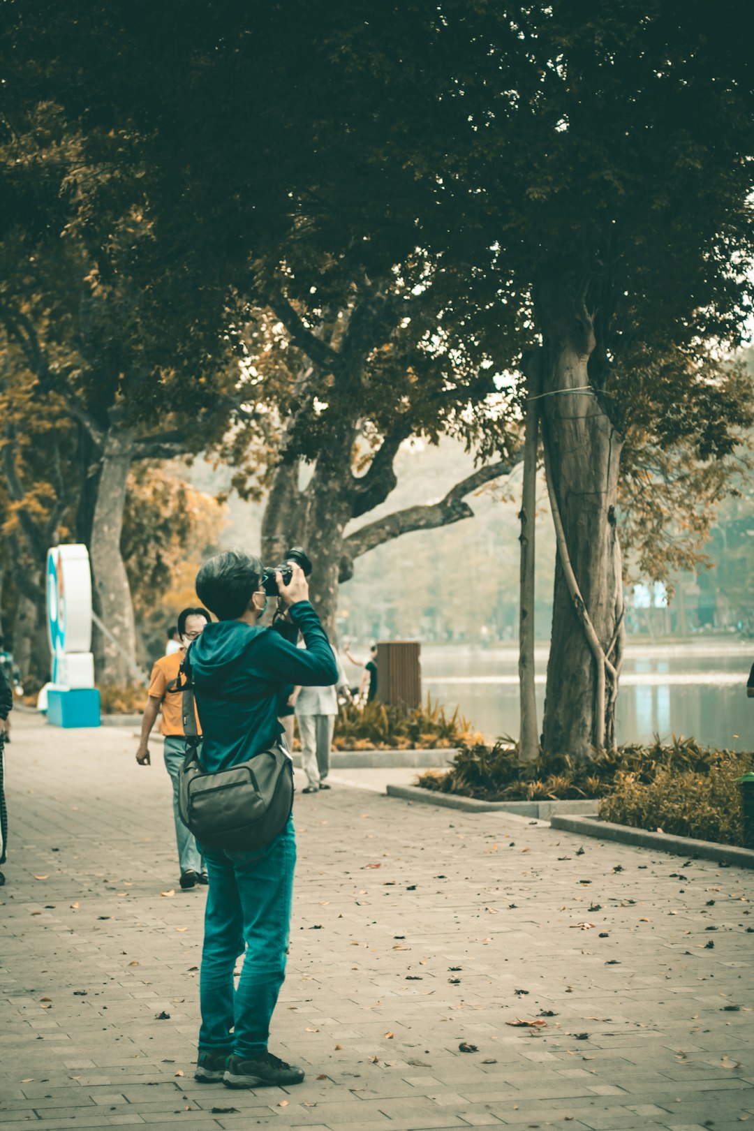 man in black jacket taking photo of woman in black jacket