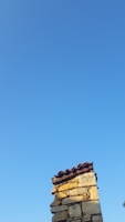 A clean chimney with a blue sky in the background.