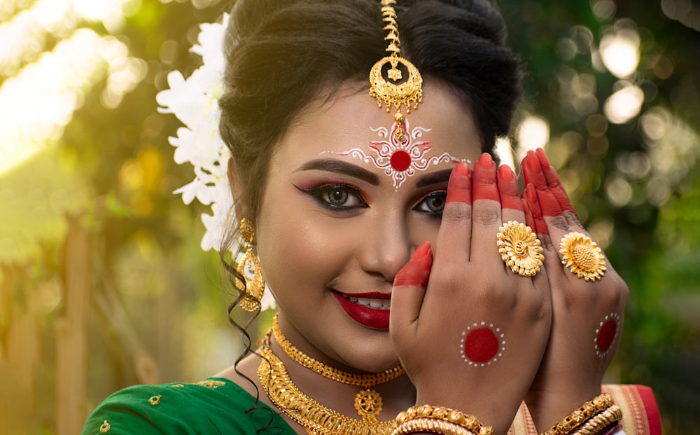 woman in green shirt with gold crown