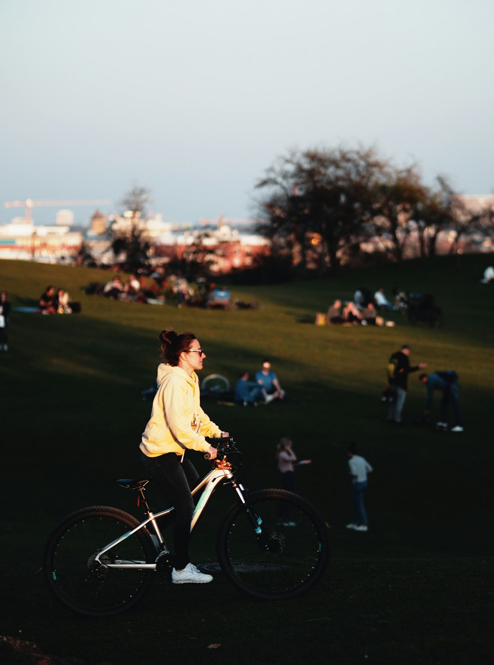 man in white shirt riding bicycle during daytime