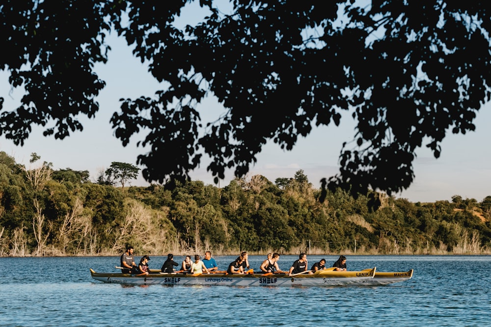 people riding on boat on body of water during daytime