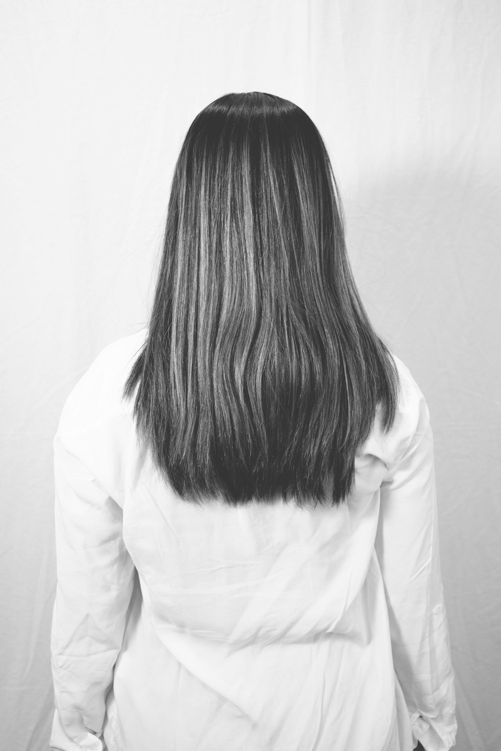 woman in white long sleeve shirt