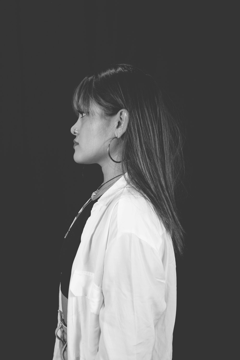 grayscale photo of woman in white button up shirt