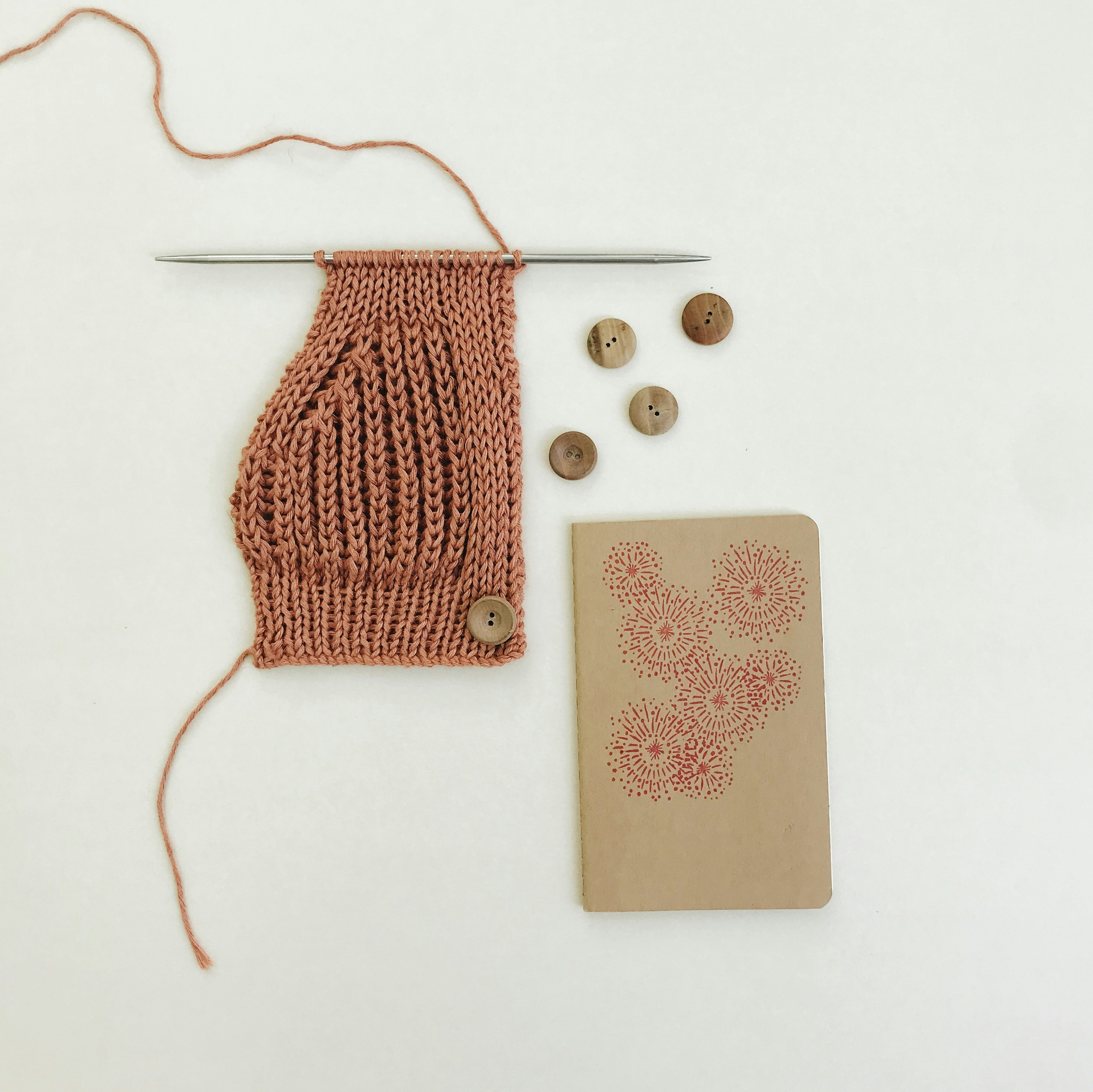 red knit sweater on white table