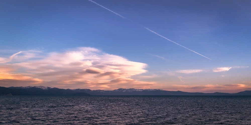 body of water under blue sky during daytime