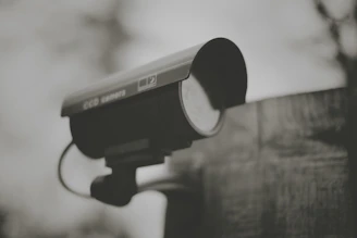 black and silver camera on black stand