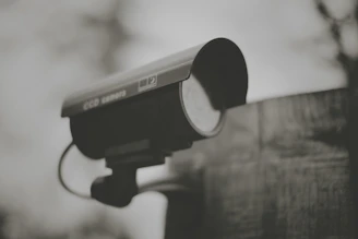 black and silver camera on black stand