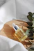 clear glass bottle on white textile