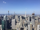 A panoramic view of a bustling city skyline where a new hotel site is being developed.