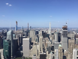 A panoramic view of a bustling city skyline where a new hotel site is being developed.
