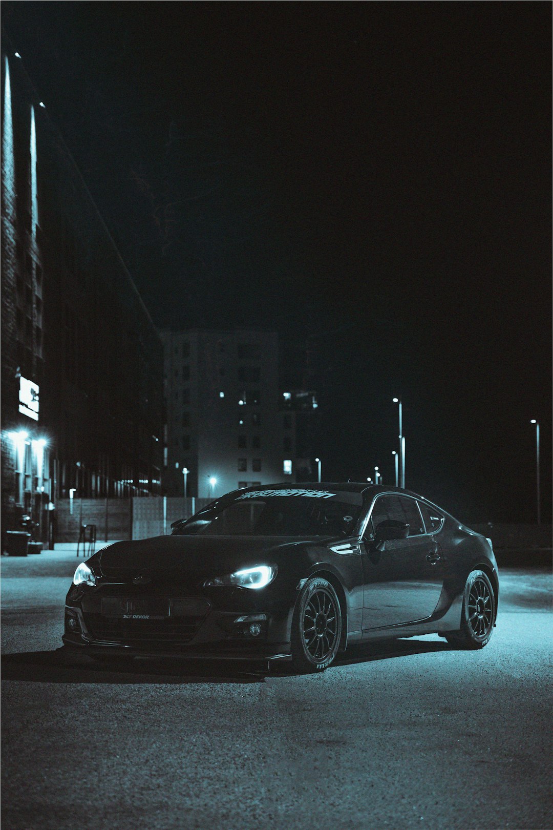 black sedan on road during night time