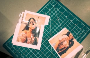 Close-up of a damaged photo with scratches and tears next to its digitally restored version