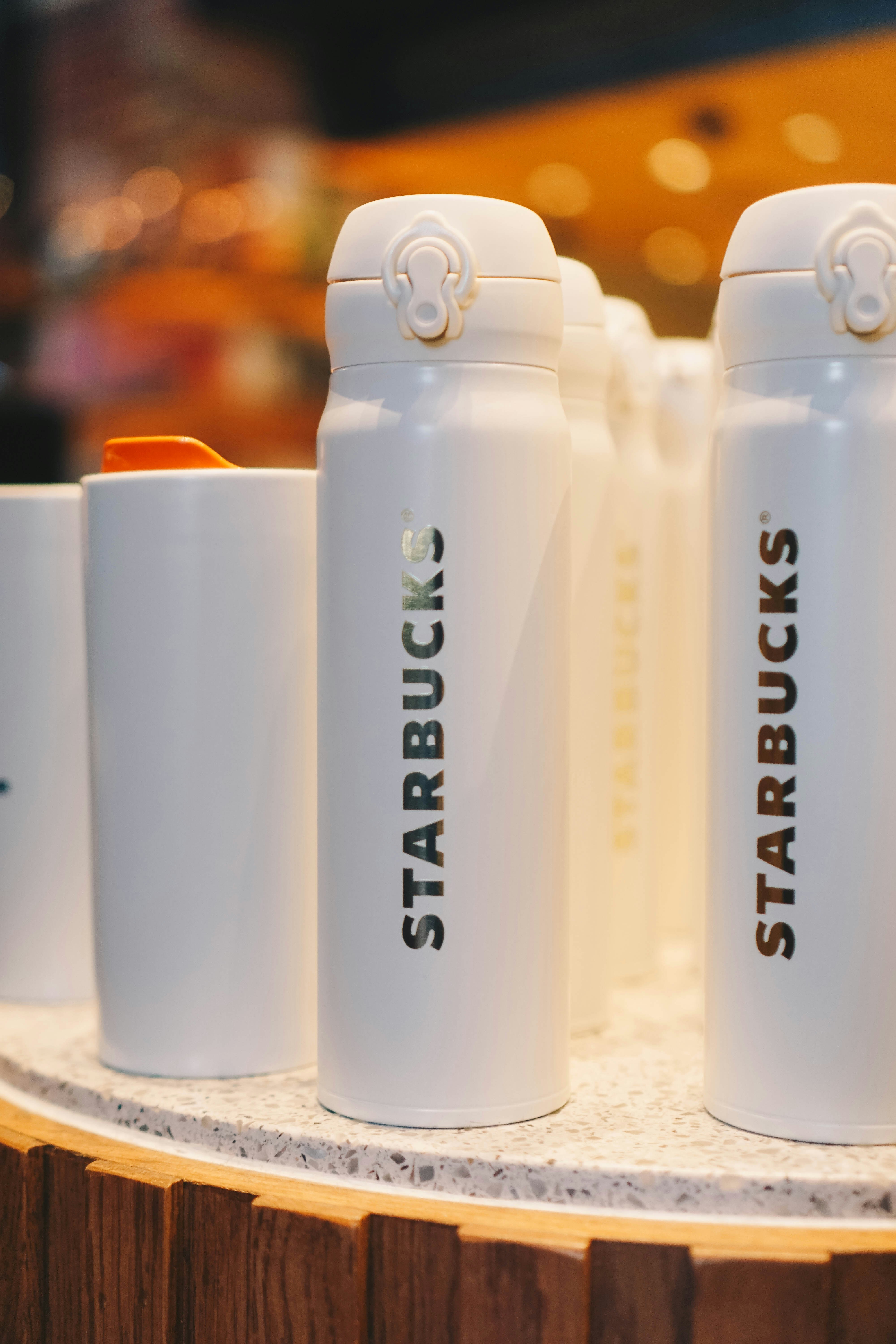 white and black ceramic mugs