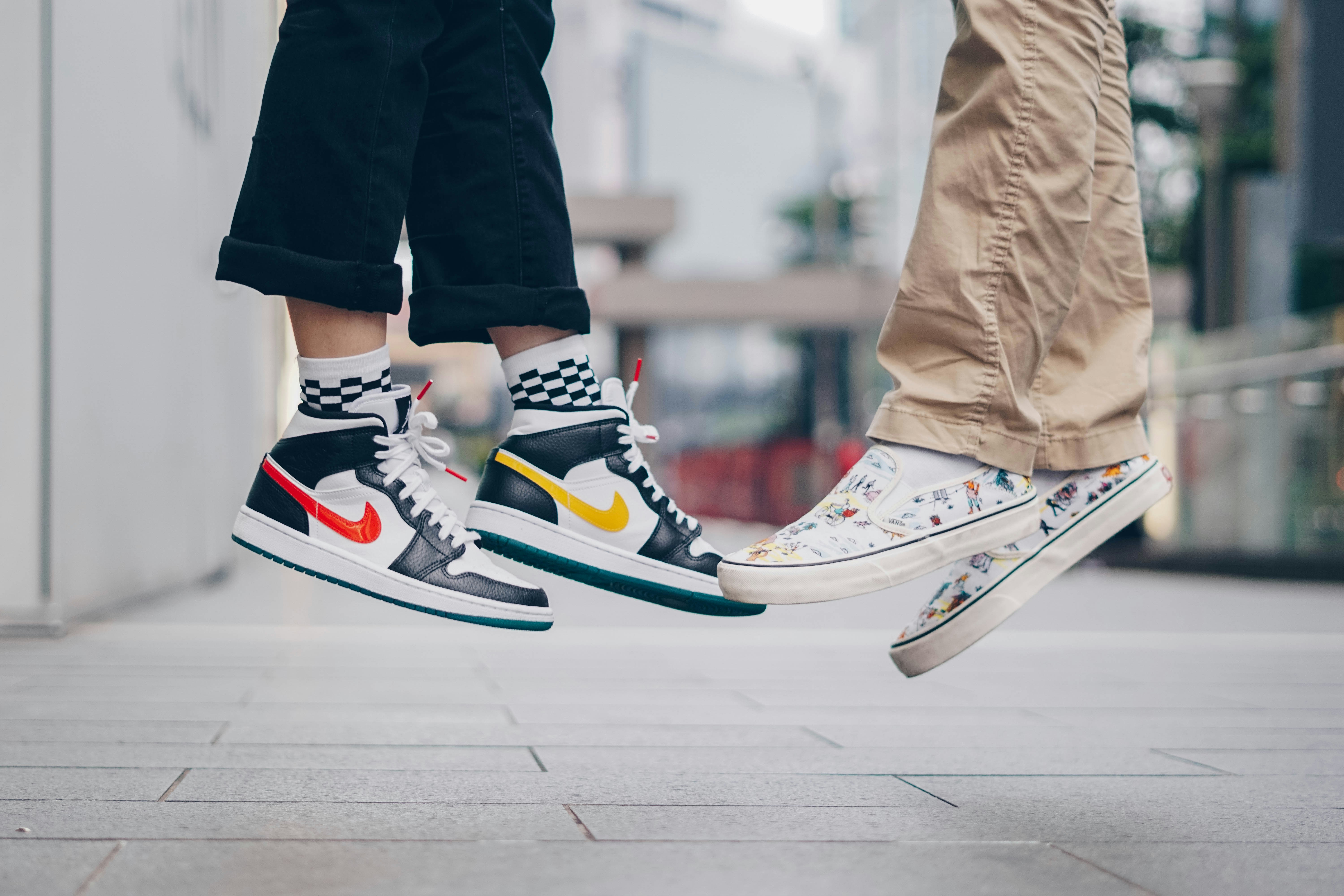 Person In Black Pants And White Red And Blue Nike Sneakers Photo Free Sneaker Photoshoot Image On Unsplash