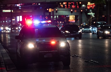 black car on road during night time