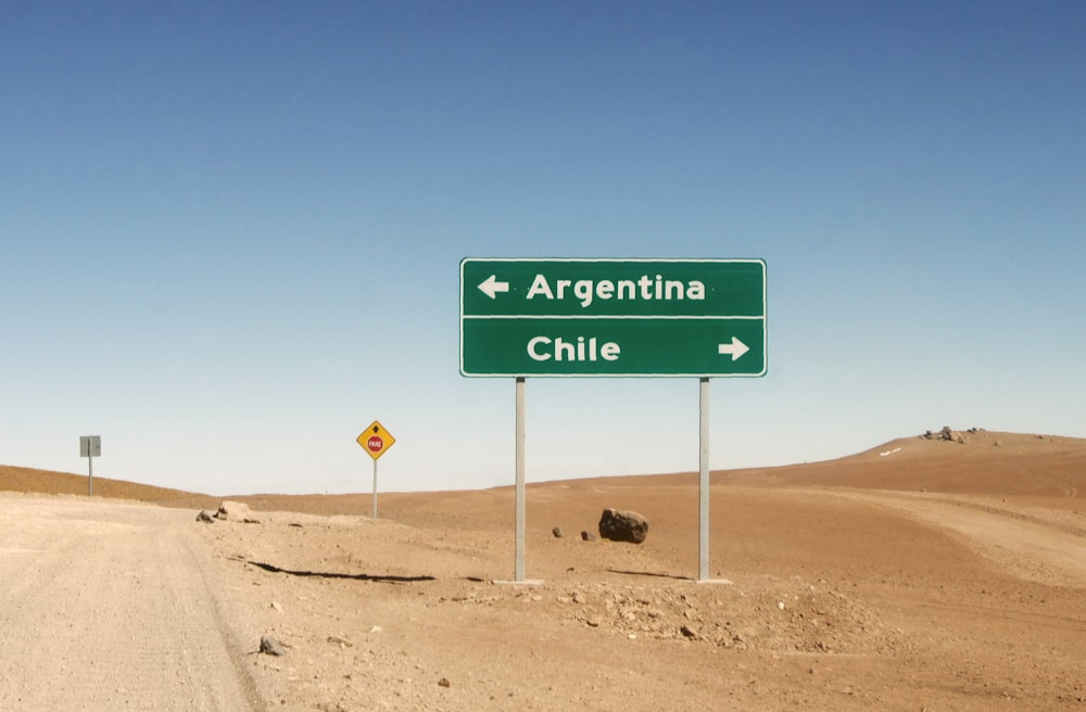 green and white road sign