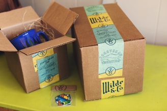 brown cardboard boxes on yellow table