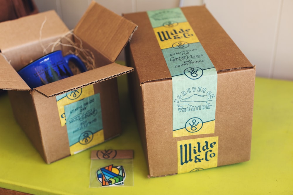 brown cardboard boxes on yellow table