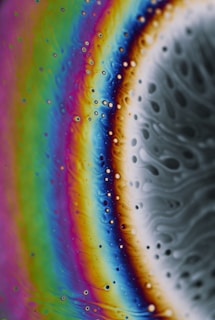 A vibrant close-up of colorful slime textures blending together in a playful swirl.