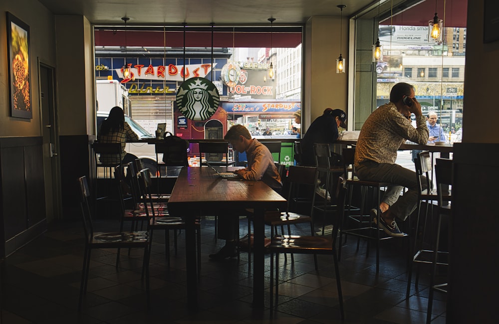 people sitting on chair in restaurant