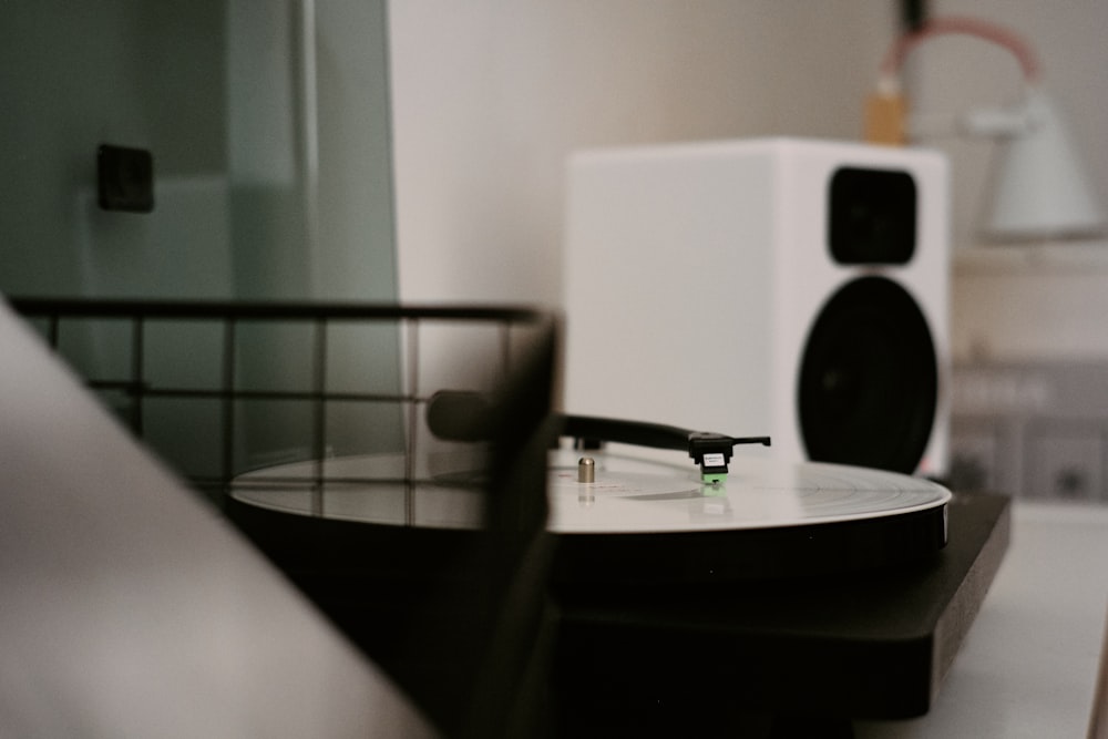 black and white speaker on table