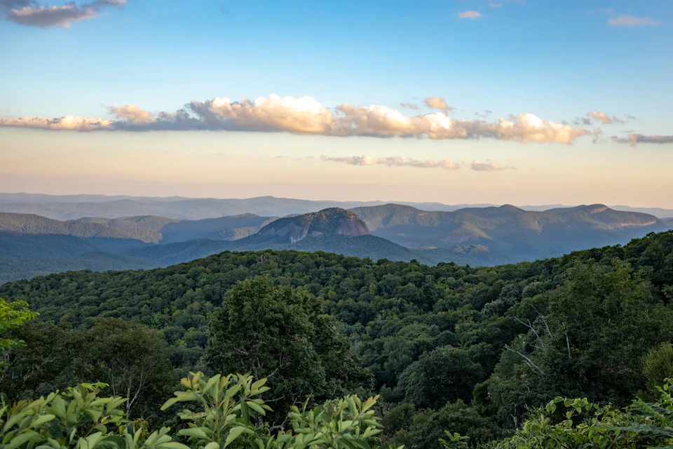 Green forested Blue Ridge mountains under an evening sky