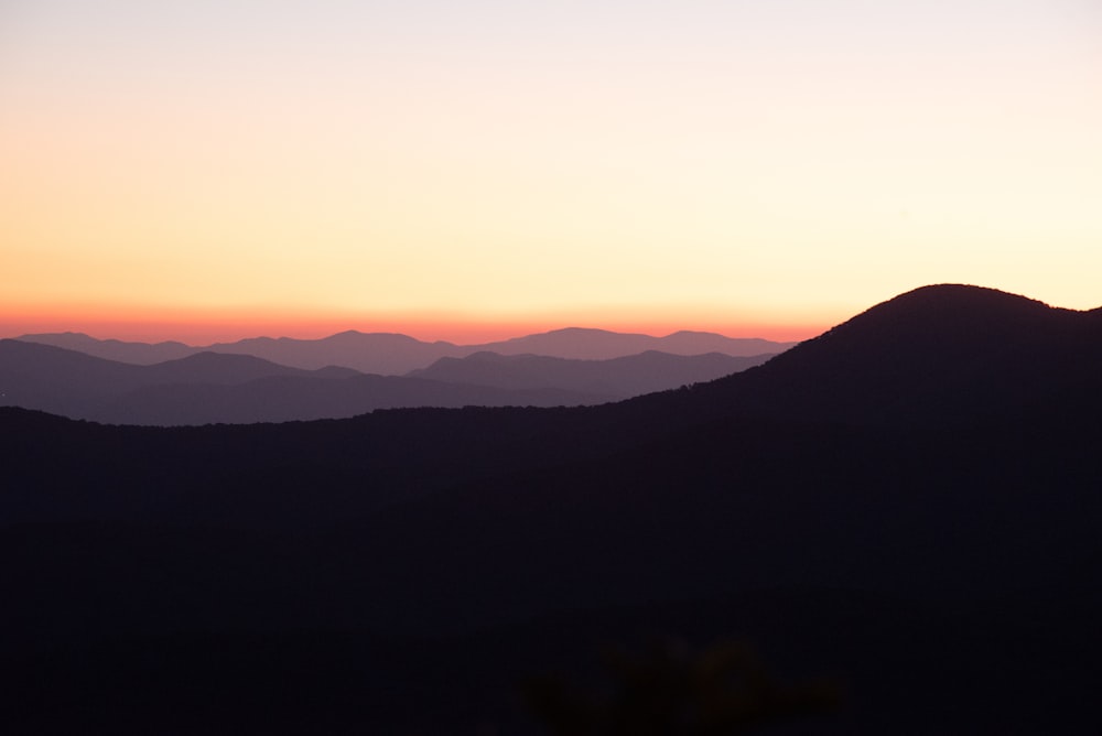 silhouette of mountains during sunset