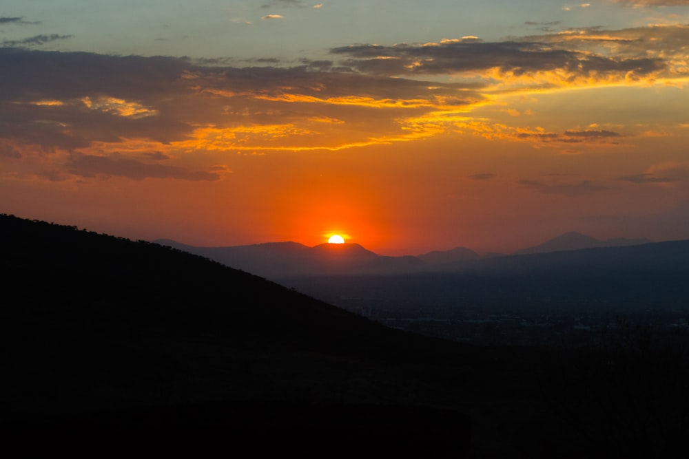 silhouette of mountains during sunset