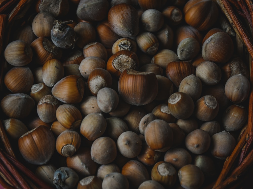 a basket filled with nuts sitting on top of a table