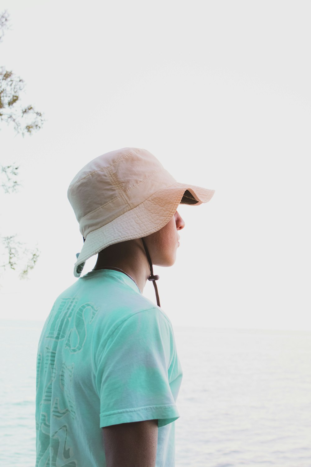 man in blue crew neck shirt wearing brown hat