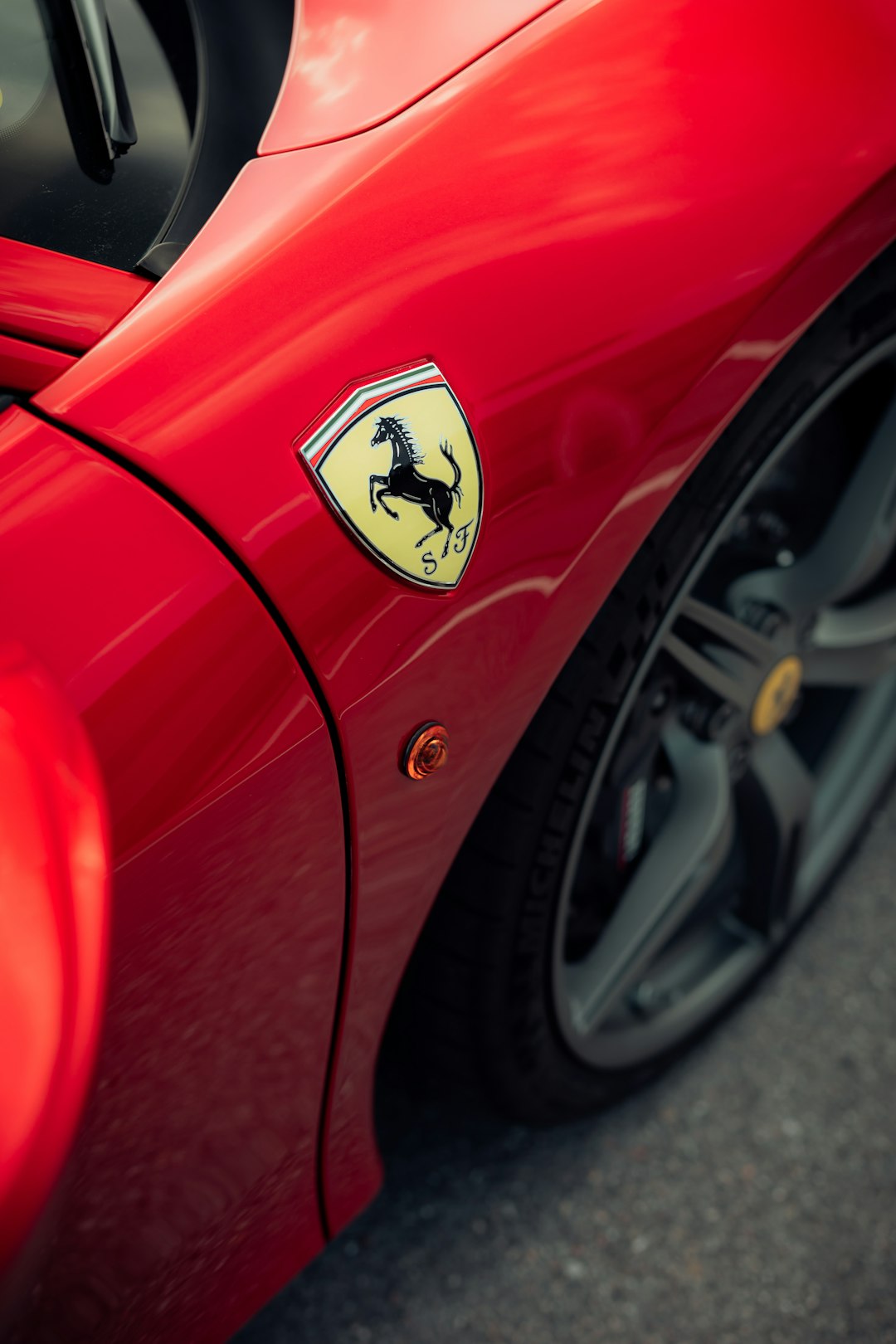 red car with yellow and black logo