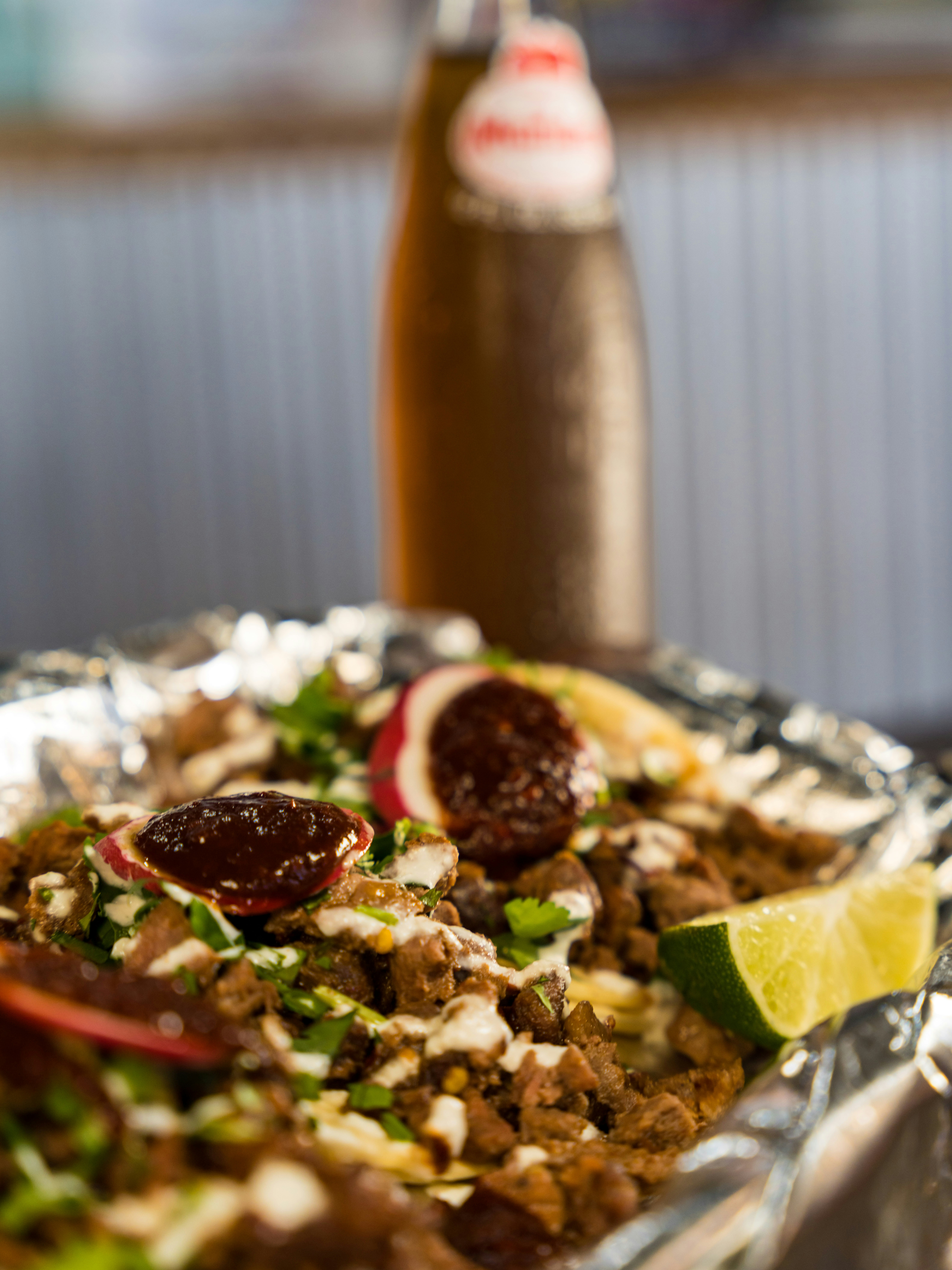 pizza with green vegetable and red sauce
