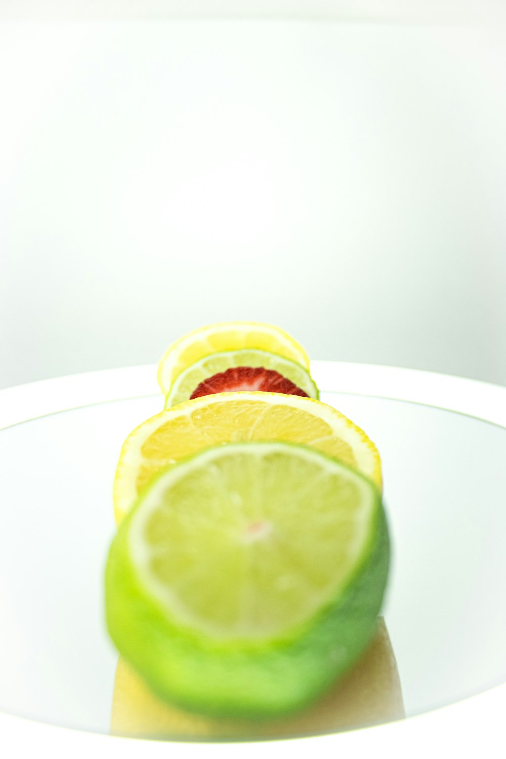 sliced lemon on white ceramic plate