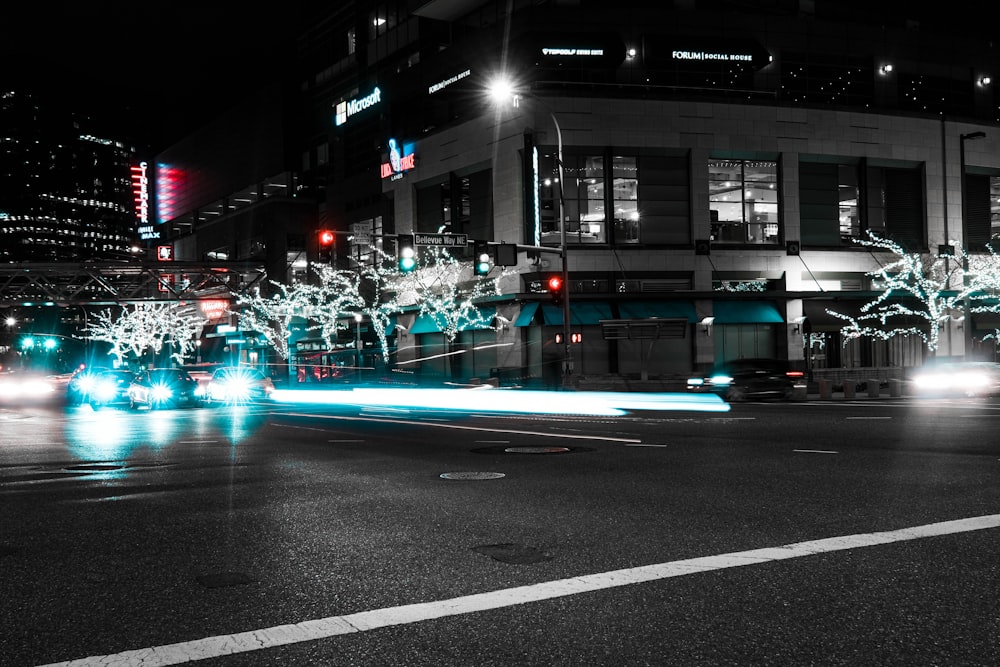 cars on road near building during night time