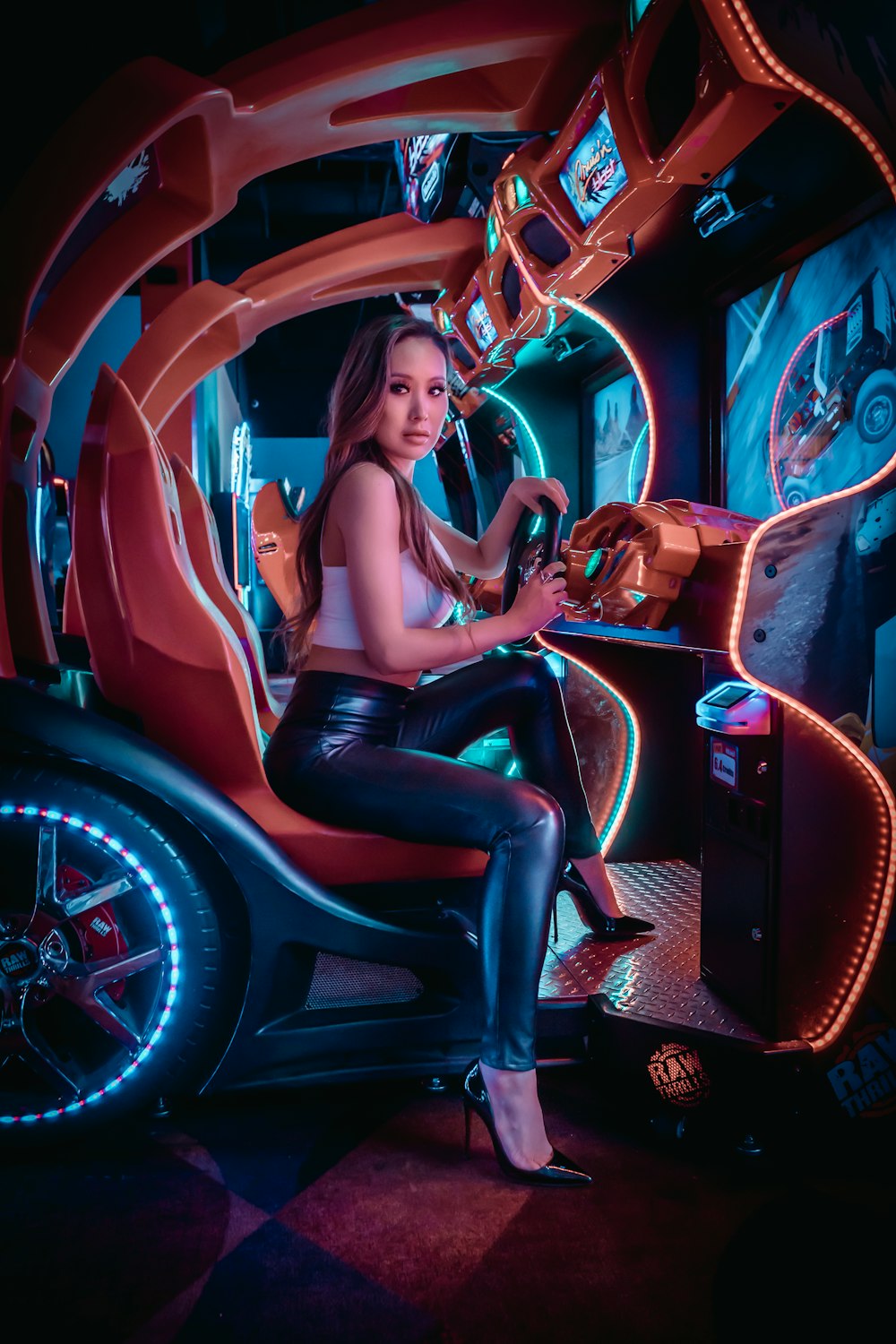 woman in black tank top sitting on brown leather car seat