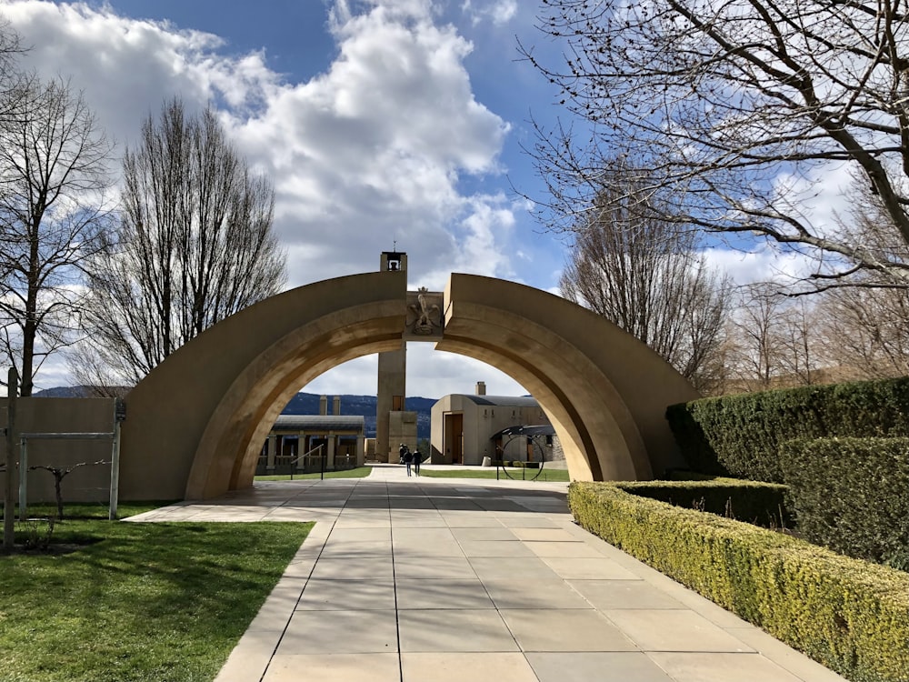 brown concrete arch under blue sky during daytime