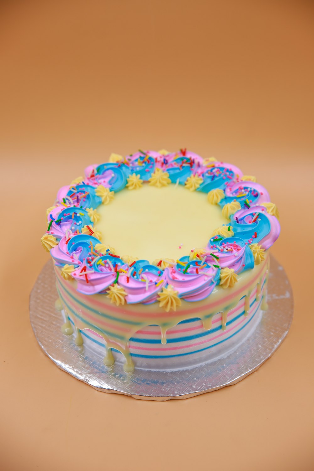 green blue and pink floral cake