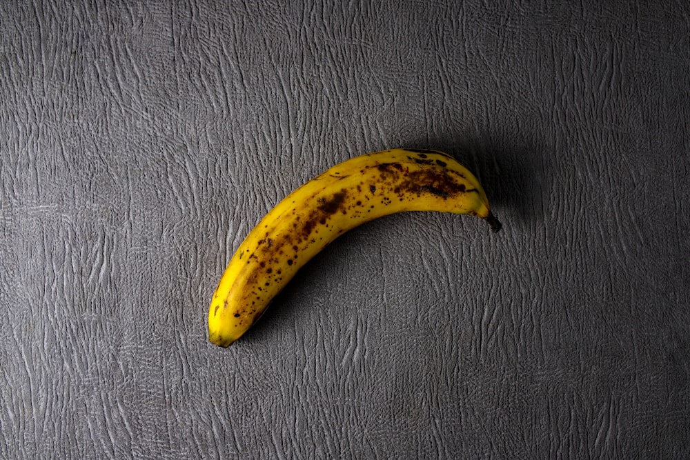 yellow banana on black leather textile