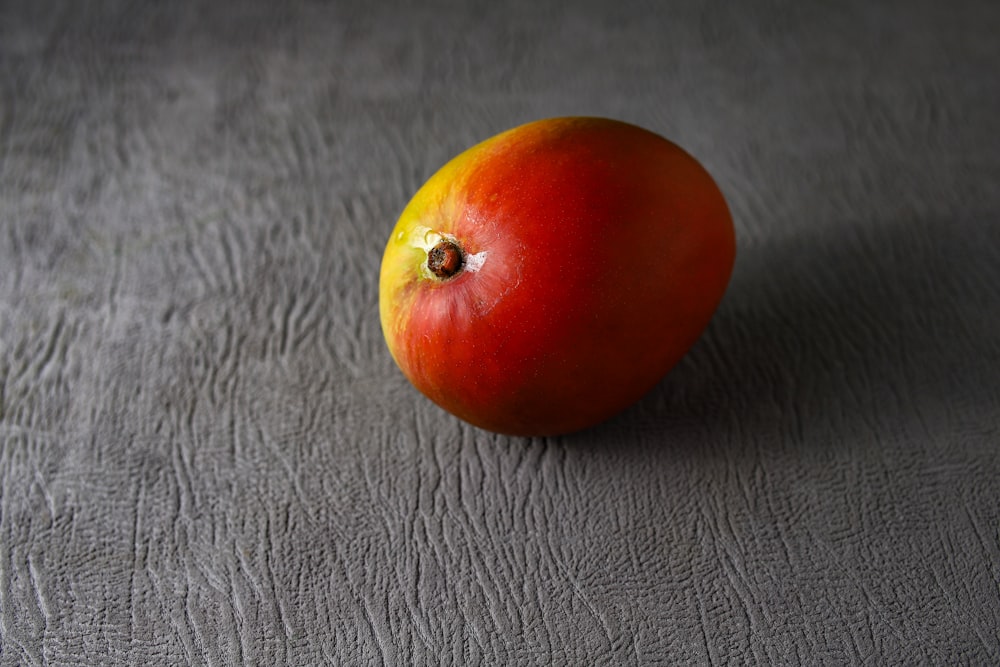 red tomato on black leather textile