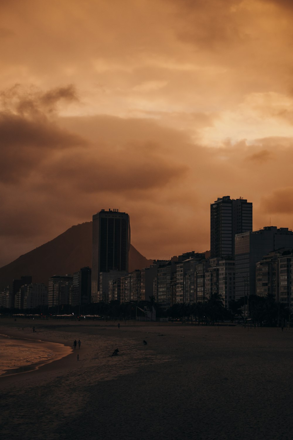 silhouette of city buildings during sunset