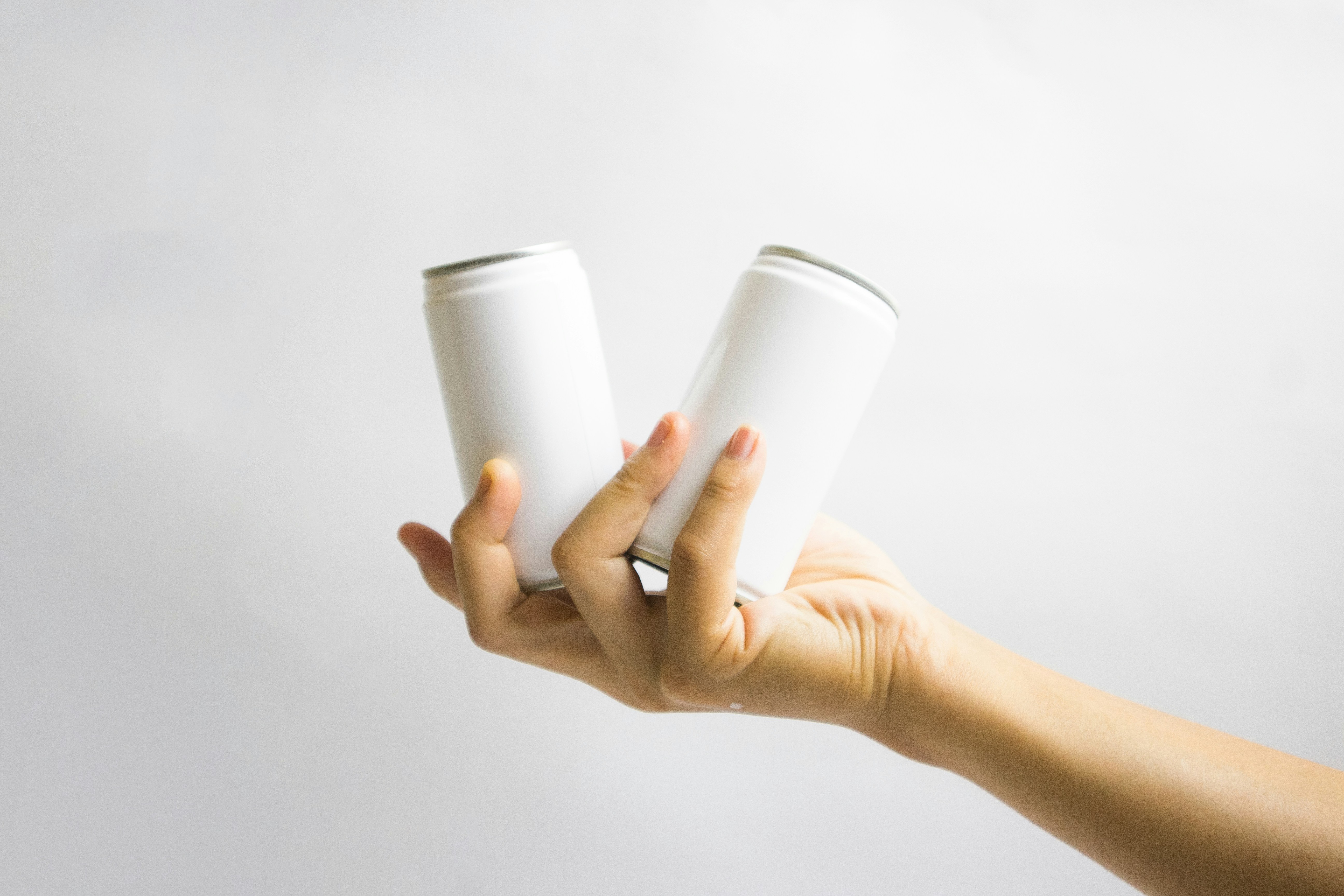 person holding white ceramic mug