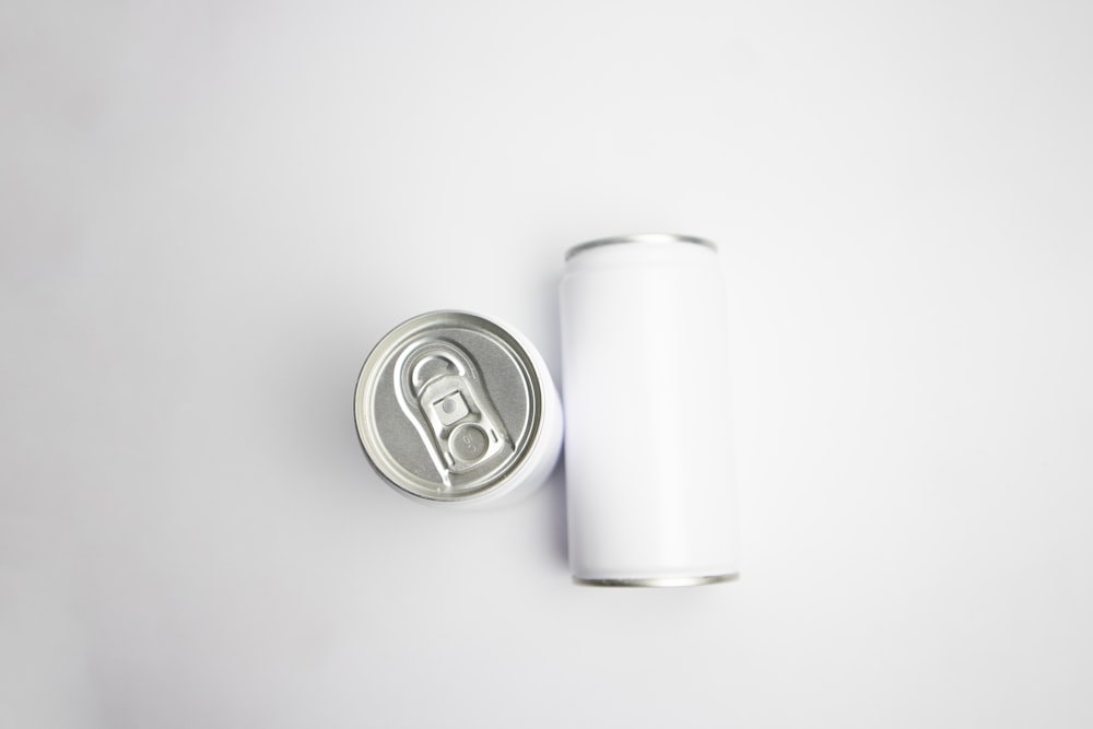 silver can on white table