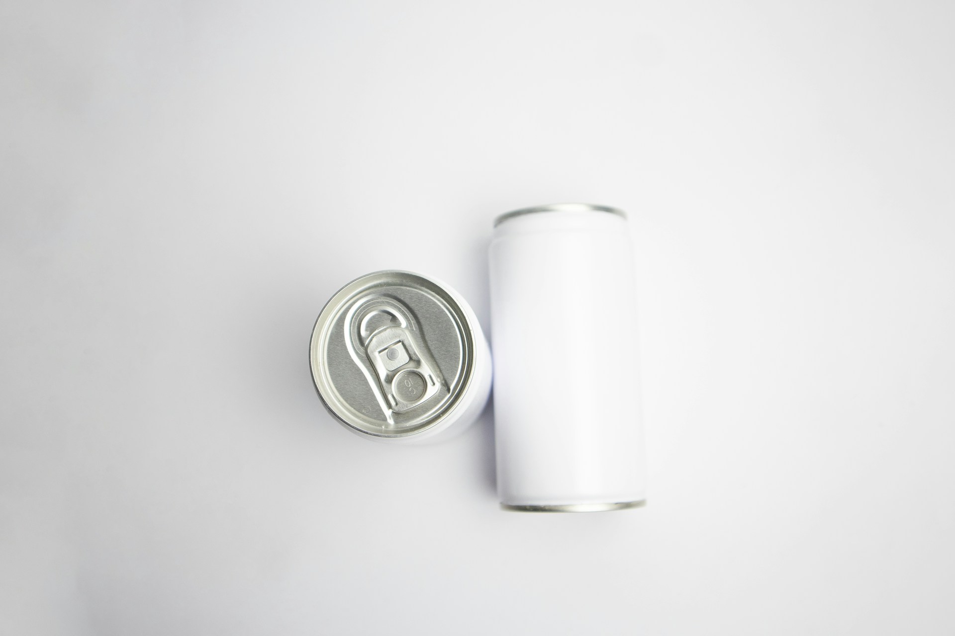 silver can on white table
