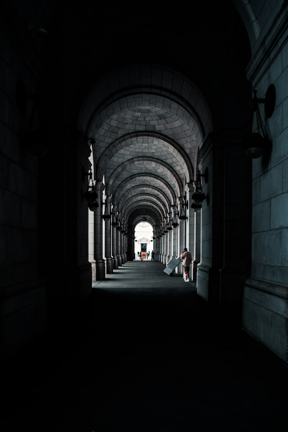 person walking on hallway during daytime